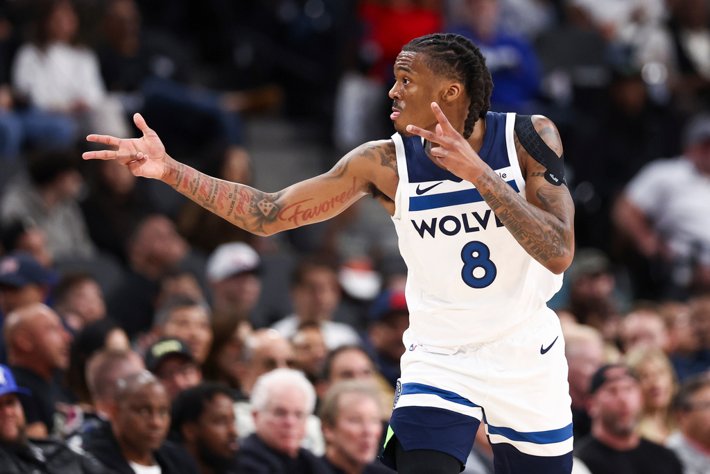 Minnesota Timberwolves guard Bones Hyland gestures after making a 3-point basket during the first half of an NBA basketball game against the Los Angeles Clippers, Wednesday, March 11, 2026, in Inglewood, Calif. (AP Photo/Jessie Alcheh)