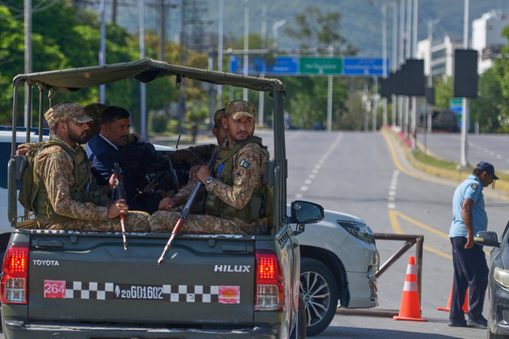 Army troops patrol at a road to ensure security ahead of the second round of the U.S. Iran officials talks, in Islamabad, Pakistan, Sunday, April 19, 2026. (AP Photo/M.A. Sheikh)