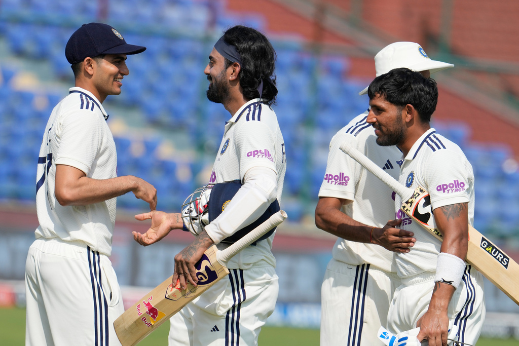 India's captain Shubman Gill congratulates teammate KL Rahul and wicketkeeper Dhruv Jurel on wining the second cricket test match between India and West Indies at the Arun Jaitley Stadium in New Delhi, India, Tuesday, Oct.14, 2025. (AP Photo/Manish Swarup)