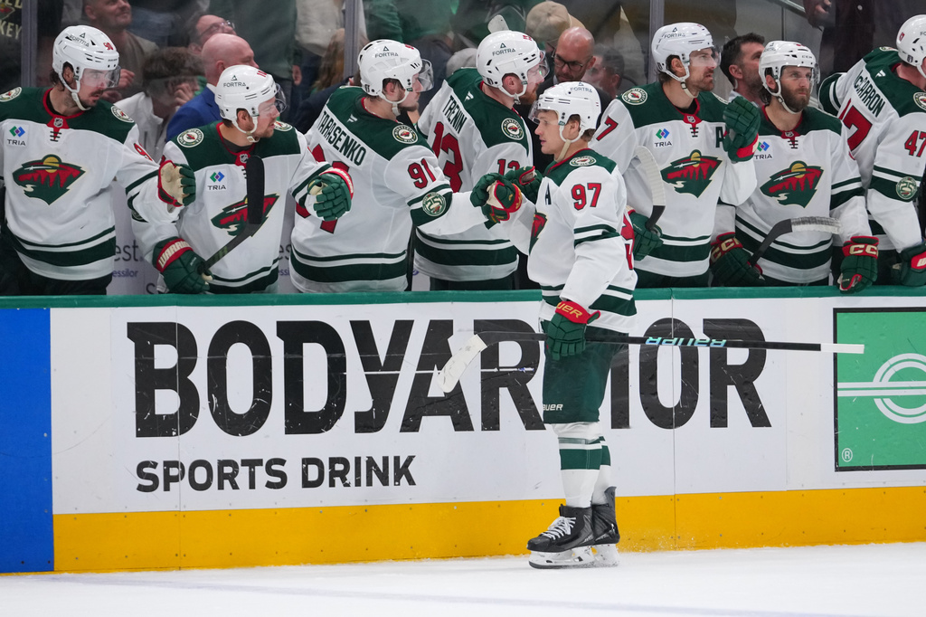 Minnesota Wild left wing Kirill Kaprizov (97) skates by his bench after scoring an open net goal against the Dallas Stars during the third period in Game 5 of a first-round NHL Stanley Cup playoffs hockey series, Tuesday, April 28, 2026, in Dallas. (AP Photo/Julio Cortez)