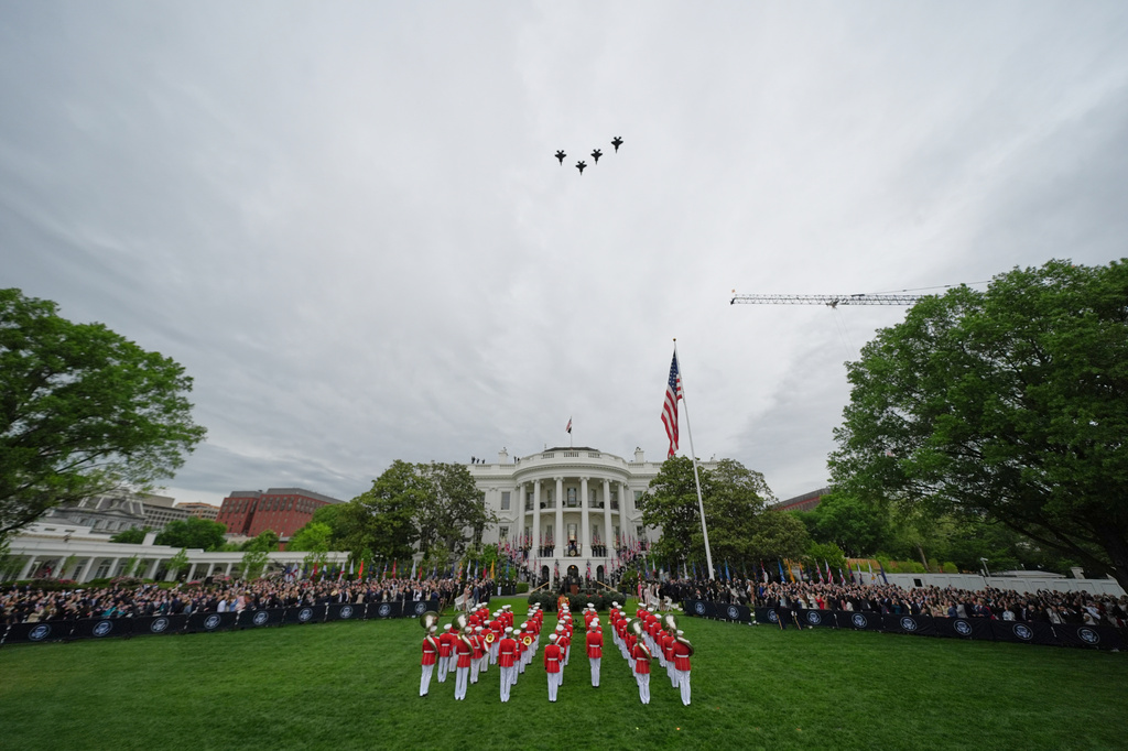 President Donald Trump and first lady Melania Trump stand on the Blue Room Balcony with Britain's King Charles III and Queen Camilla as plane fly over during a State Visit arrival ceremony on the South Lawn of the White House, Tuesday, April 28, 2026, in Washington. (AP Photo/Alex Brandon)
