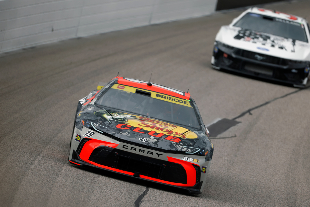Chase Briscoe (19) heads through Turn 1 during a NASCAR Cup Series auto race in Kansas City, Kan., Sunday, Sept. 27, 2026. (AP Photo/Colin E. Braley)