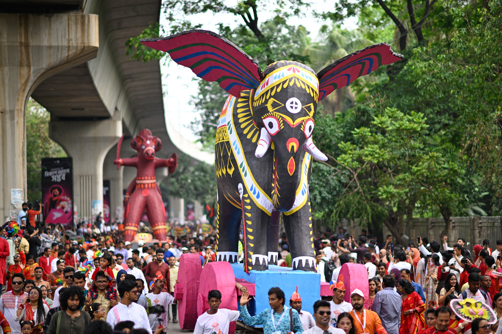 People participate at the Baishakhi Shobhajatra procession to celebrate the first day of the Bangla New Year in Dhaka, Bangladesh, Tuesday, April 14, 2026. (AP Photo/Mahmud Hossain Opu)