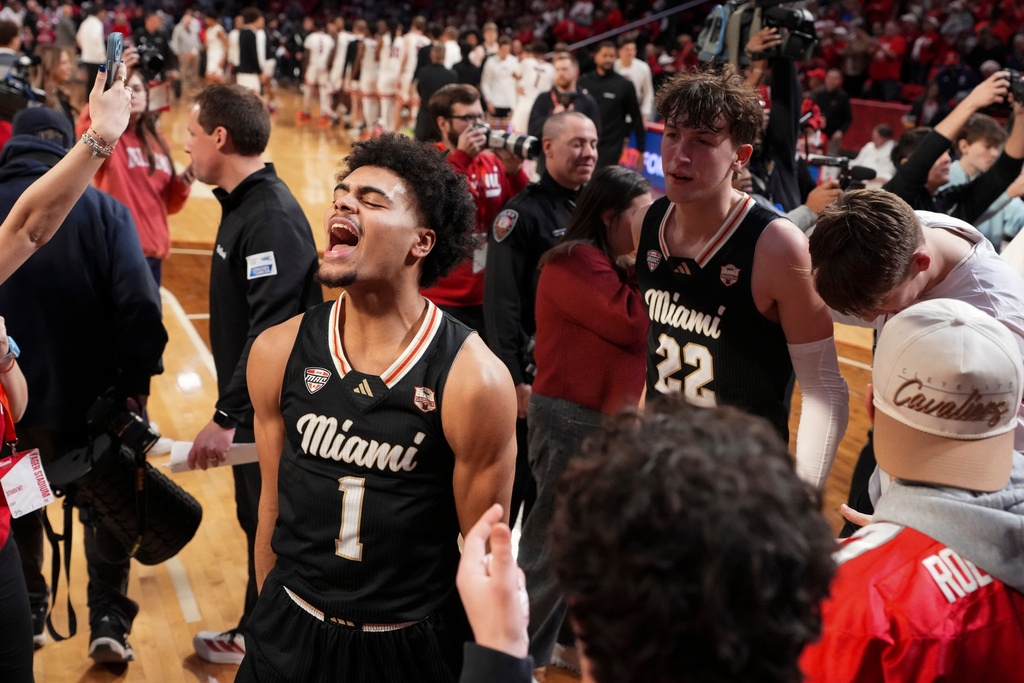 Miami (Ohio) Trey Perry (1) celebrates with teammate Brant Byers (22) following an NCAA college basketball game against Northern Illinois, Saturday, Jan. 31, 2026, in Oxford, Ohio. (AP Photo/Jeff Dean)