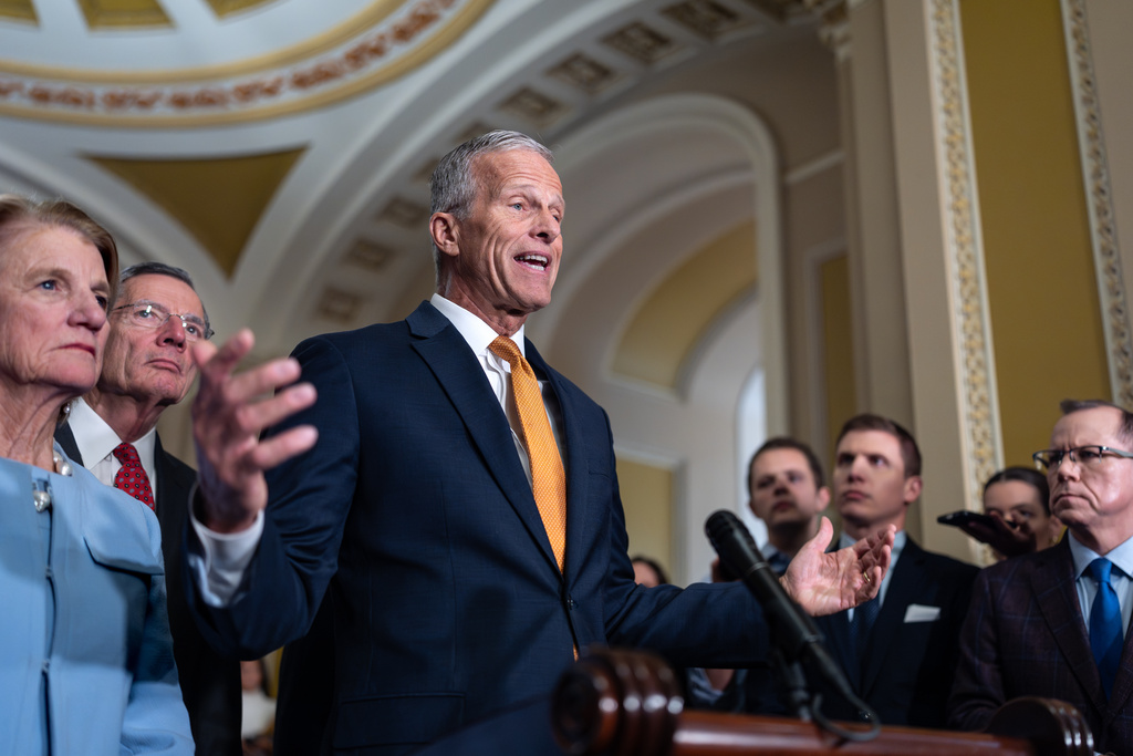 Senate Majority Leader John Thune, R-S.D., joined at left by Sen. Shelly Moore Capito, R-W.Va., and Sen. John Barrasso, R-Wyo., the GOP whip, speaks with reporters following a closed-door meeting with Vice President JD Vance on day 28 of the government shutdown, at the Capitol in Washington, Tuesday, Oct. 28, 2025. (AP Photo/J. Scott Applewhite)