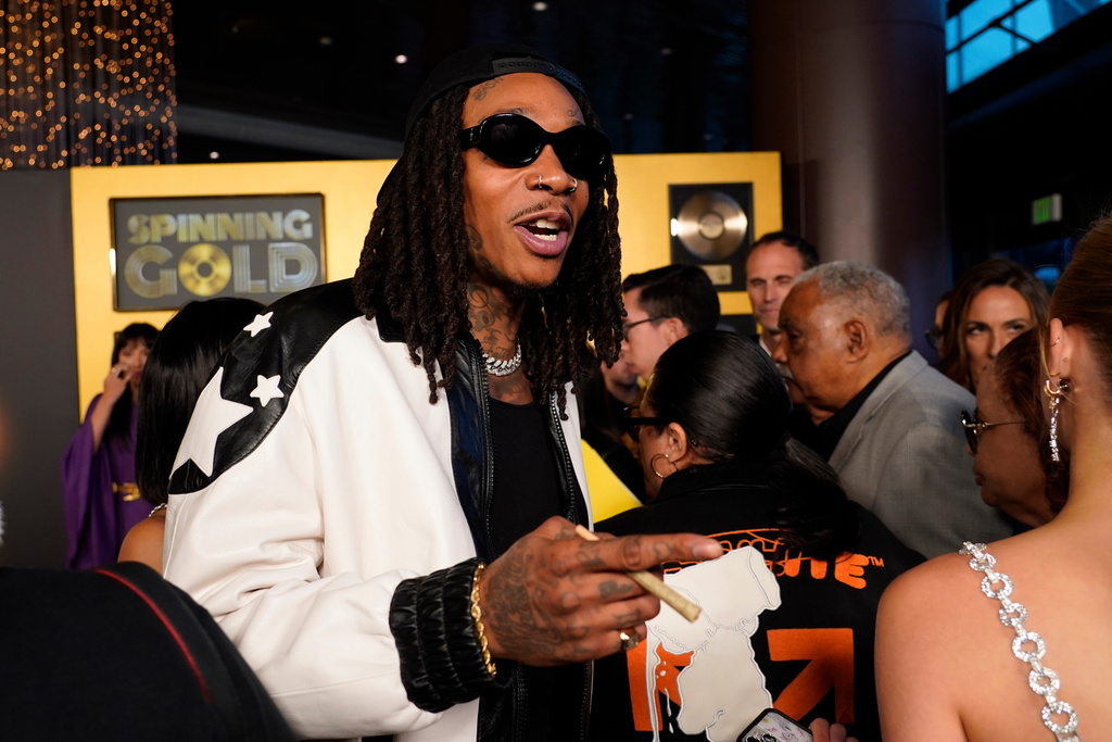 FILE - Wiz Khalifa, a cast member in "Spinning Gold," arrives at the premiere of the film, Wednesday, March 29, 2023, at the Directors Guild of America in Los Angeles. (AP Photo/Chris Pizzello, File)
