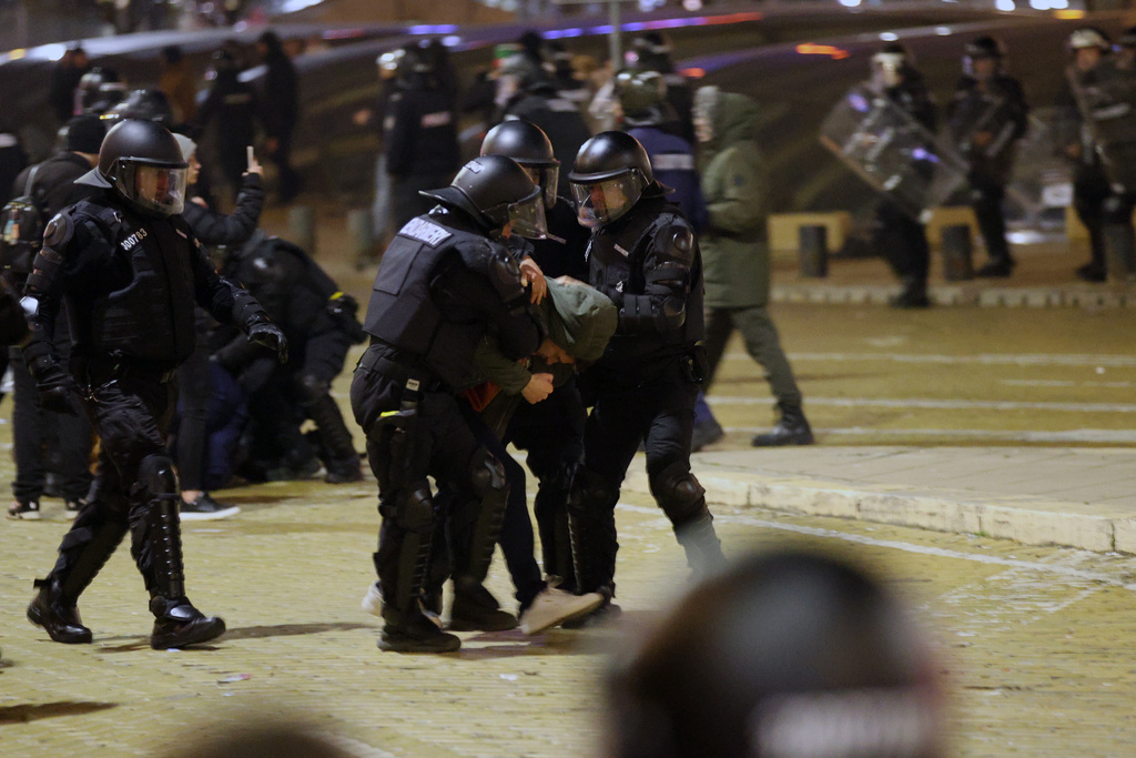 CORRECTED THE BYLINE AND SOURCE FOR THE BULGARIAN NEWS AGENCY - Police detain protesters during a rally against austerity measures in next year's draft budget, in Sofia, Monday, Dec 1, 2025. (Bulgarian News Agency via AP)