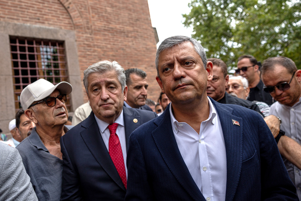 Turkey's deposed main opposition Republican People's Party (CHP) leader Ozgur Ozel, right, meets supporters after submitting a registration petition to create a new party called "Yeni Party" in Ankara, Turkey, Friday, July 24, 2026. (Ugur Yildirim/DIA Photo via AP)