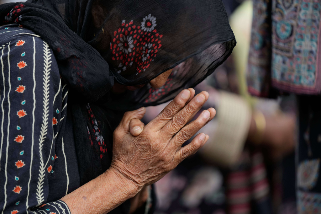An Indian Christian devotee pray during a procession to mark Good Friday in Jammu, India, Friday, April 3, 2026.(AP Photo/Channi Anand)