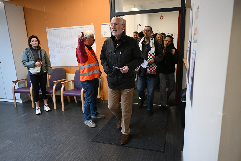 Frans Timmermans, of the center-left two party bloc of Labor Party and Green Left, center, arrives at a polling station during general elections in Maastricht, Netherlands, Wednesday, Oct. 29, 2025. (AP Photo/Ermindo Armino)
