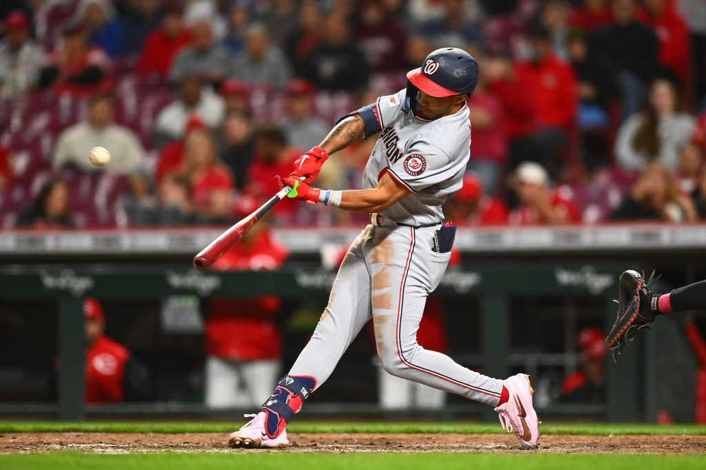 Washington Nationals' Daylen Lile hits a two-run home run during the tenth inning of a baseball game against the Cincinnati Reds in Cincinnati, Wednesday, May 13, 2026. (AP Photo/Ben Jackson)