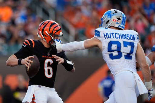 Detroit Lions defensive end Aidan Hutchinson (97) grabs Cincinnati Bengals quarterback Jake Browning (6) by the facemask during the first half of an NFL football game Sunday, Oct. 5, 2025, in Cincinnati. (AP Photo/Carolyn Kaster) Detroit Lions defensive end Aidan Hutchinson (97) grabs Cincinnati Bengals quarterback Jake Browning (6) by the facemask during the first half of an NFL football game Sunday, Oct. 5, 2025, in Cincinnati. (AP Photo/Carolyn Kaster)