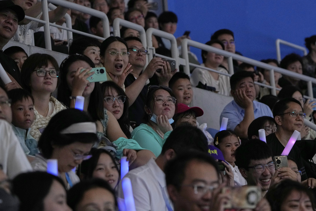People attend the opening ceremony of the World Humanoid Robot Games held in Beijing, China, Thursday, Aug. 14, 2025. (AP Photo/Mahesh Kumar A.)