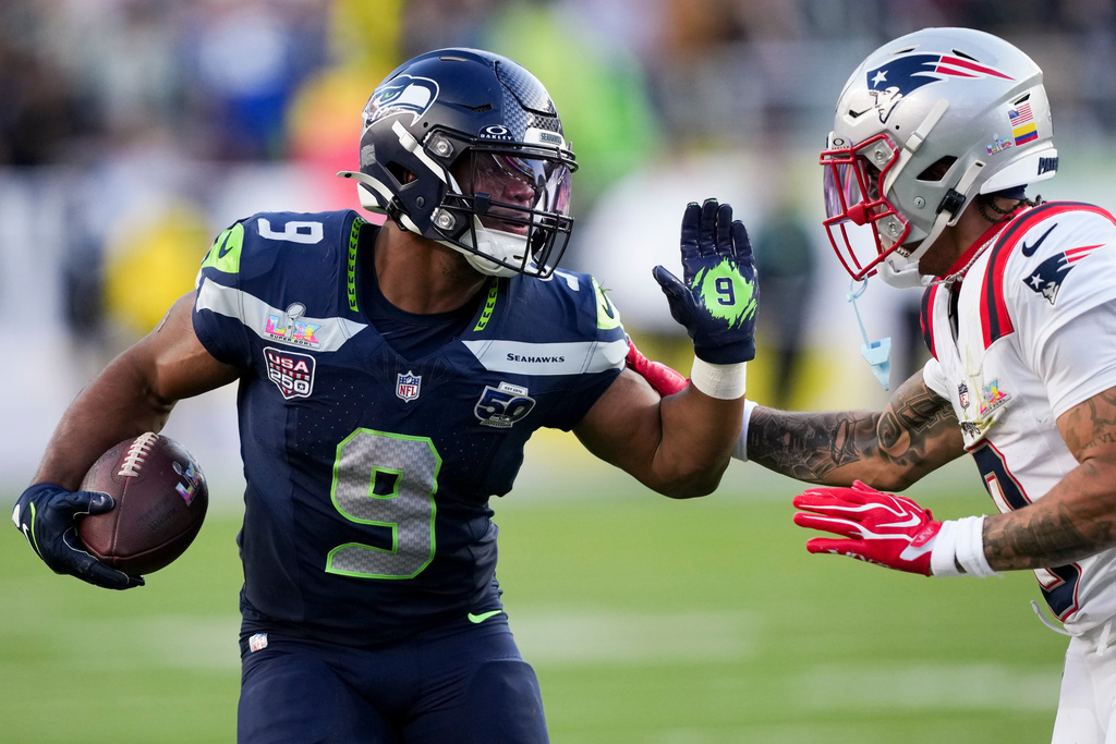Seattle Seahawks running back Kenneth Walker III (9) runs with the ball during the first half of the NFL Super Bowl 60 football game against the New England Patriots, Sunday, Feb. 8, 2026, in Santa Clara, Calif. (AP Photo/Brynn Anderson)