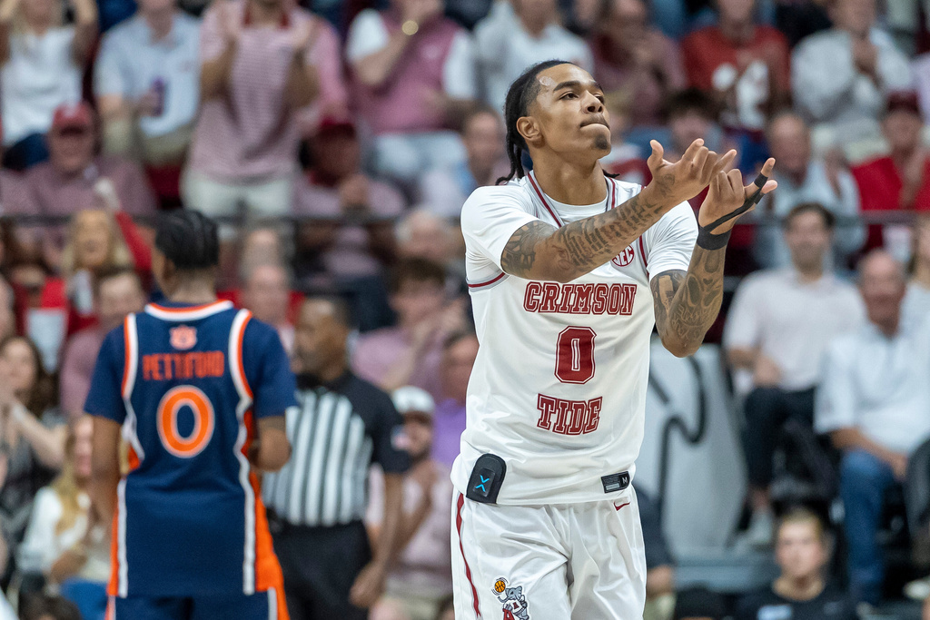 Alabama guard Labaron Philon Jr. (0) celebrates after a 3-point basket during the first half of an NCAA college basketball game against Auburn, Saturday, March 7, 2026, in Tuscaloosa, Ala. (AP Photo/Vasha Hunt)