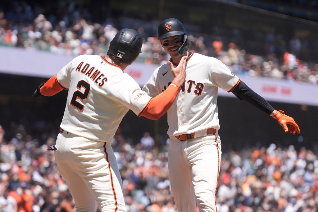 San Francisco Giants' Daniel Susac, right, celebrates after hitting a three-run home run that also scored Willy Adames (2) and Jung Hoo Lee during the second inning of a baseball game against the Milwaukee Brewers, Wednesday, July 29, 2026, in San Francisco. (AP Photo/Jeff Chiu)