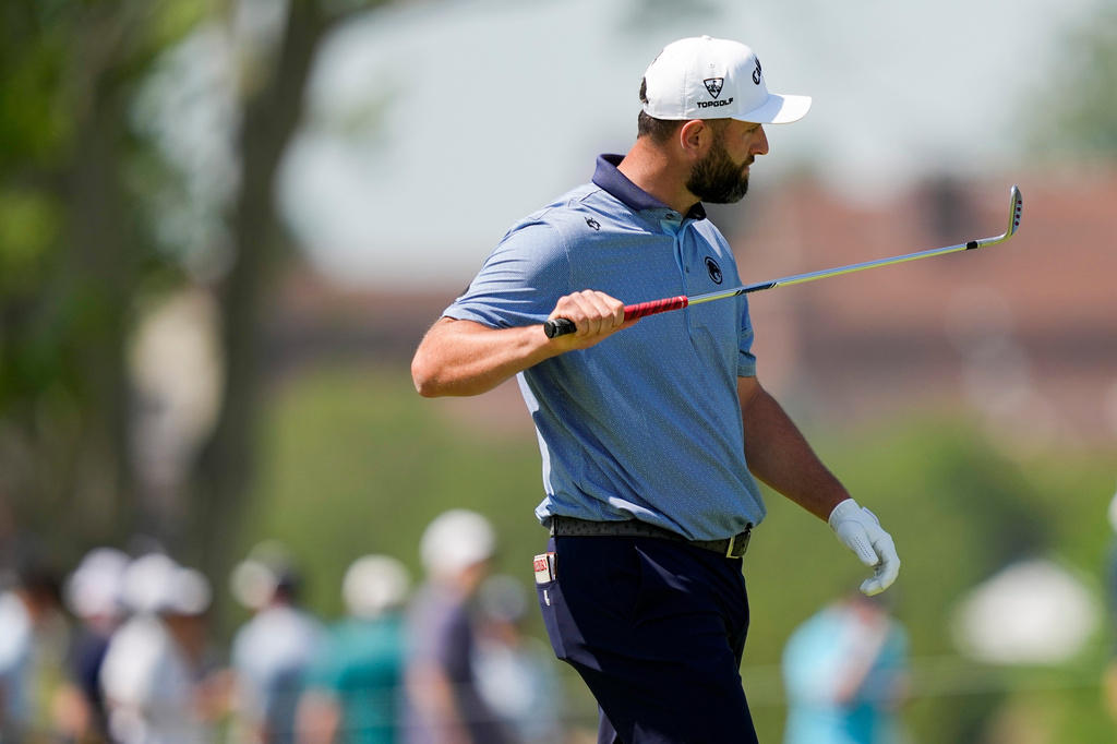 Jon Rahm, of Spain, looks at his club on the third fairway during the final round of the PGA Championship golf tournament at Aronimink Golf Club, Sunday, May 17, 2026, in Newtown Square, PA. (AP Photo/Matt Slocum)