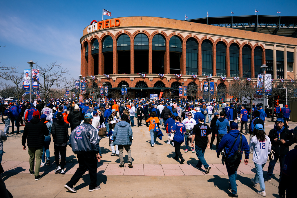 Fans arrive to Citi Field for an opening-day baseball game between the New York Mets and the Pittsburgh Pirates, Thursday, March 26, 2026, in New York. (AP Photo/Angelina Katsanis)