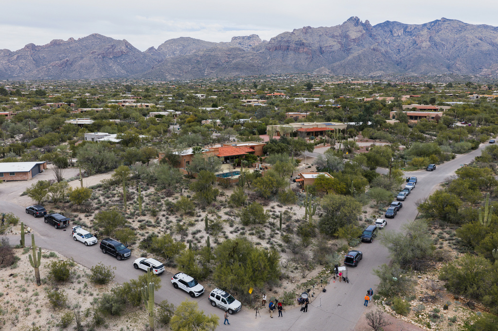 Members of the press work in the neighborhood near the home of Nancy Guthrie, the missing mother of “Today” show host Savannah Guthrie, Thursday, Feb. 5, 2026, in Tucson, Ariz. (AP Photo/Caitlin O'Hara)
