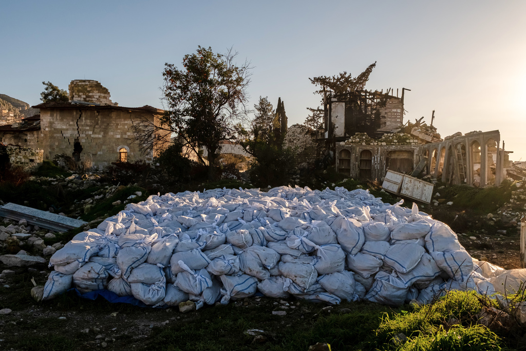 Sacks of rubble removed from the ruins of St. Paul's Greek Orthodox Church, heavily damaged in the February 2023 earthquake, are placed at the site in Antakya, southern Turkey, Wednesday, Feb. 4, 2026. (AP Photo/Murat Kocabas)
