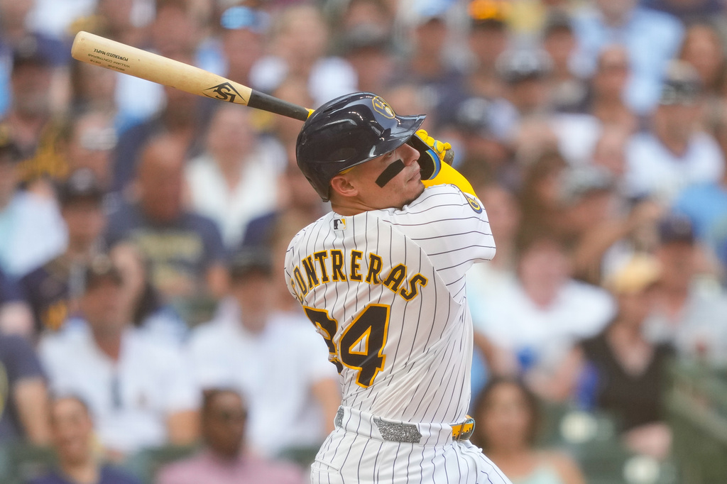 Milwaukee Brewers' William Contreras hits an RBI double allowing Jackson Chourio to score during the third inning of a baseball game against the Miami Marlins Saturday, July 18, 2026, in Milwaukee. (AP Photo/Kayla Wolf)
