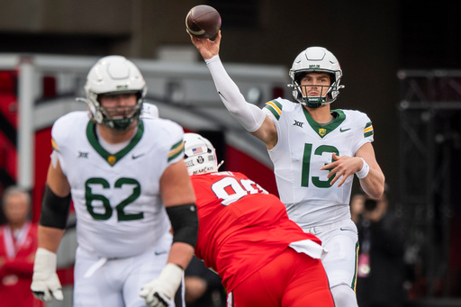 Baylor Bears Sawyer Robertson (13) throws downfield during the second quarter of an NCAA college football game against Cincinnati, Saturday, Oct. 25, 2025, in Cincinnati. (AP Photo/Tanner Pearson) Baylor Bears Sawyer Robertson (13) throws downfield during the second quarter of an NCAA college football game against Cincinnati, Saturday, Oct. 25, 2025, in Cincinnati. (AP Photo/Tanner Pearson)