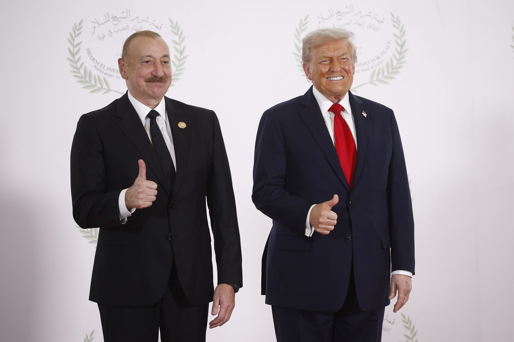 Azerbaijani President Ilham Aliyev and President Donald Trump pose during the greetings ceremony before the family picture at the Gaza International Peace Summit, in Sharm el-Sheikh, Egypt, Monday, Oct.13 2025. (Yoan Valat, Pool photo via AP)