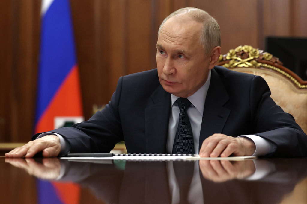 Russian President Vladimir Putin listens to Rostec State Corporation CEO Sergei Chemezov during their meeting at the Kremlin in Moscow, Thursday, May 7, 2026. (Mikhail Metzel/Sputnik, Kremlin Pool Photo via AP)