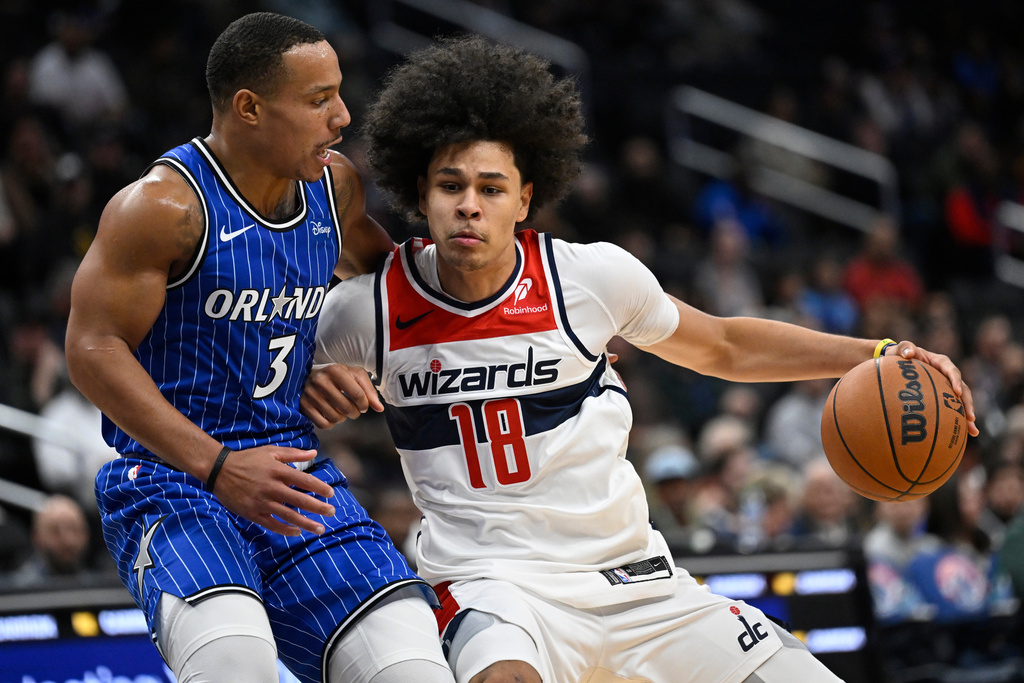 Orlando Magic guard Desmond Bane (3) guards Washington Wizards forward Kyshawn George (18) during the first half of an NBA basketball game, Saturday, Nov. 1, 2025, in Washington. (AP Photo/John McDonnell)
