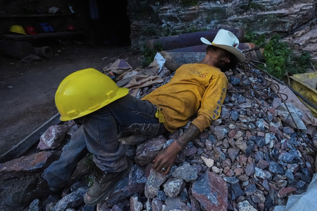 A miner rests after his shift at a mercury mine in San Joaquin, Mexico, Tuesday, Aug. 19, 2025. (AP Photo/Fernando Llano)