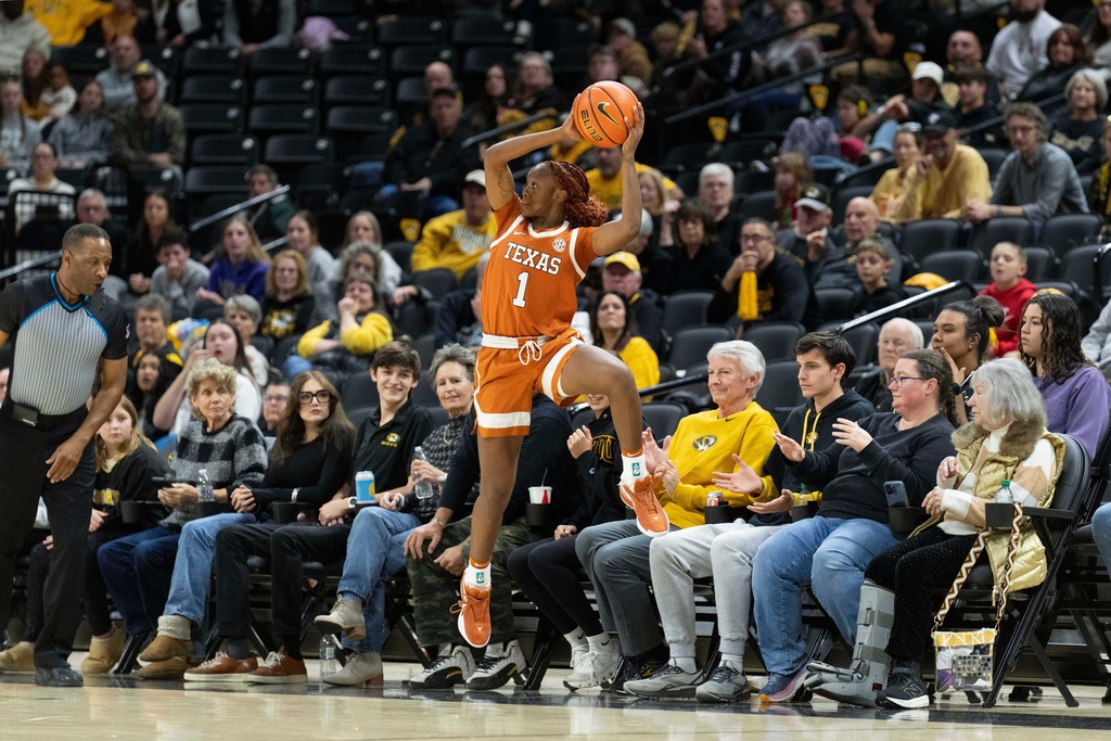 Texas' Bryanna Preston saves a ball from going out of bounds during the first half of an NCAA women's basketball game against Missouri Thursday, Jan. 1, 2026, in Columbia, Mo. (AP Photo/L.G. Patterson)
