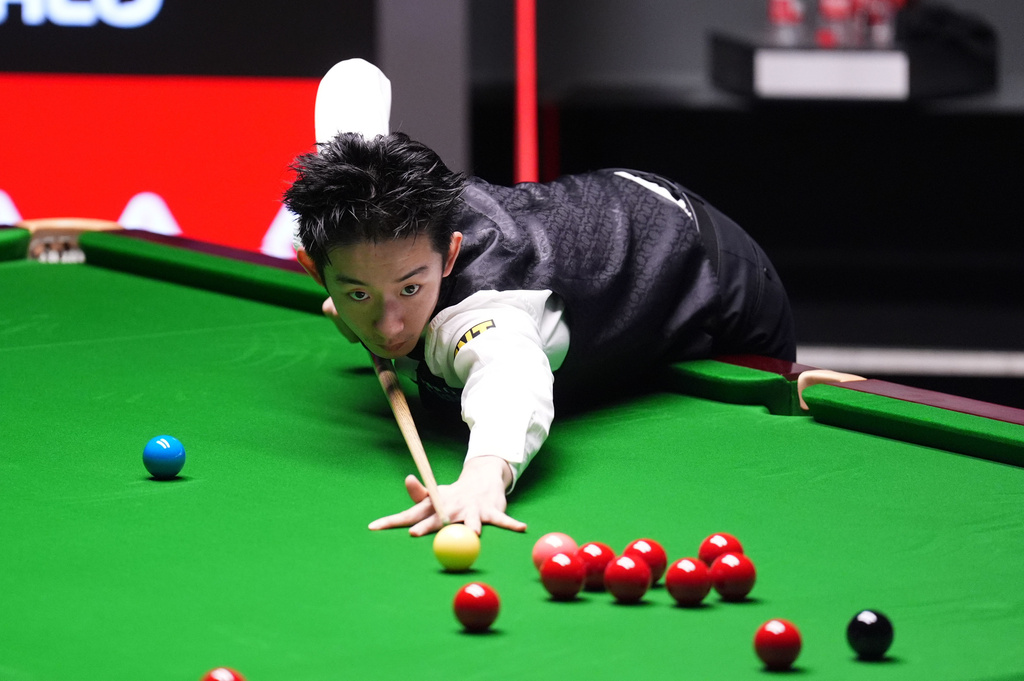 China's Wu Yize during his match against England's Shaun Murphy on day sixteen of the World Snooker Championship 2026 in Sheffield, England, Sunday, May 3, 2026. (Mike Egerton/PA via AP)