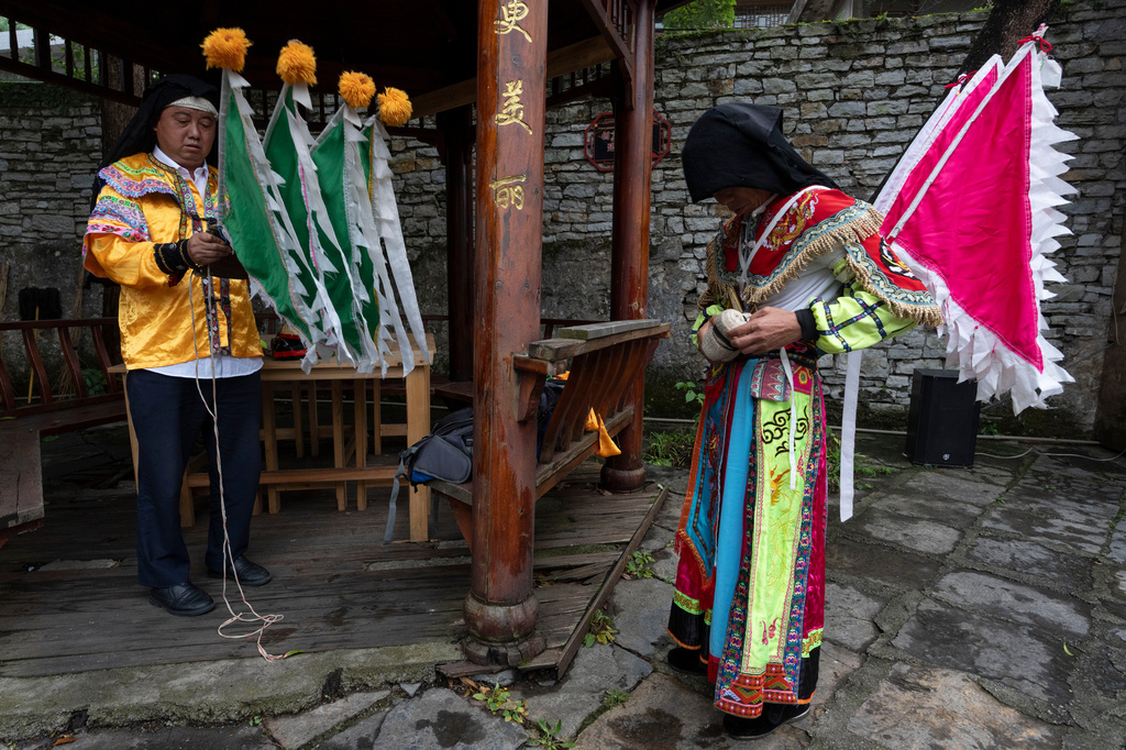 Performers prepare for a Dixi opera show at Tianlong Tunpu, an ancient town in southwestern China's Guizhou province on Thursday, May 28, 2026. (AP Photo/Ng Han Guan)
