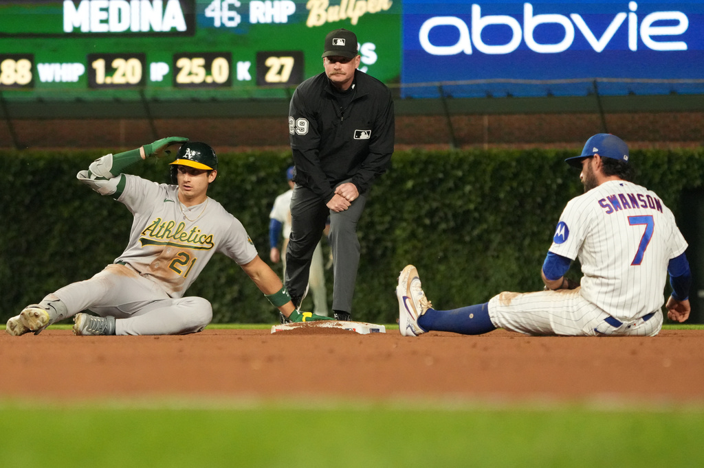 Chicago Cubs shortstop Dansby Swanson (7) tags out Athletics' Tyler Soderstrom (21) at second base during the eighth inning in a baseball game Wednesday, June 3, 2026, in Chicago. (AP Photo/David Banks)