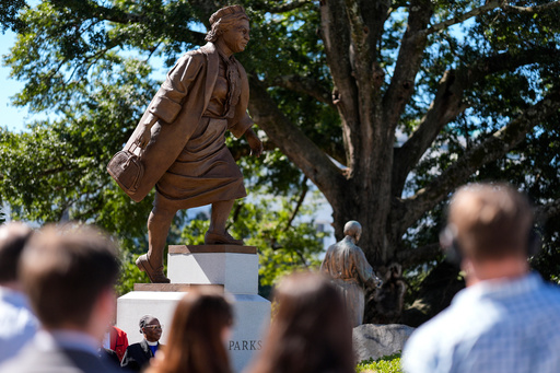 People view a newly unveiled statue of Rosa Parks on the grounds of the Alabama State Capitol, Friday, Oct. 24, 2025, in Montgomery, Ala. (AP Photo/Mike Stewart) People view a newly unveiled statue of Rosa Parks on the grounds of the Alabama State Capitol, Friday, Oct. 24, 2025, in Montgomery, Ala. (AP Photo/Mike Stewart)