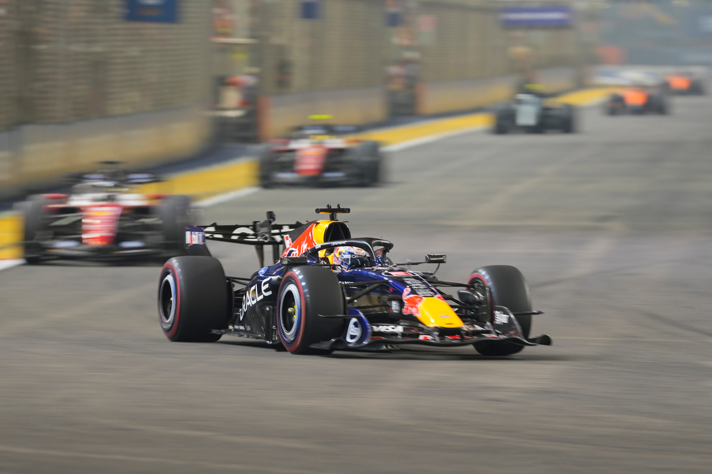 Red Bull driver Max Verstappen of the Netherlands steers his car during the Singapore Formula One Grand Prix race in Singapore, Sunday, Oct. 11, 2026. (AP Photo/Vincent Thian)