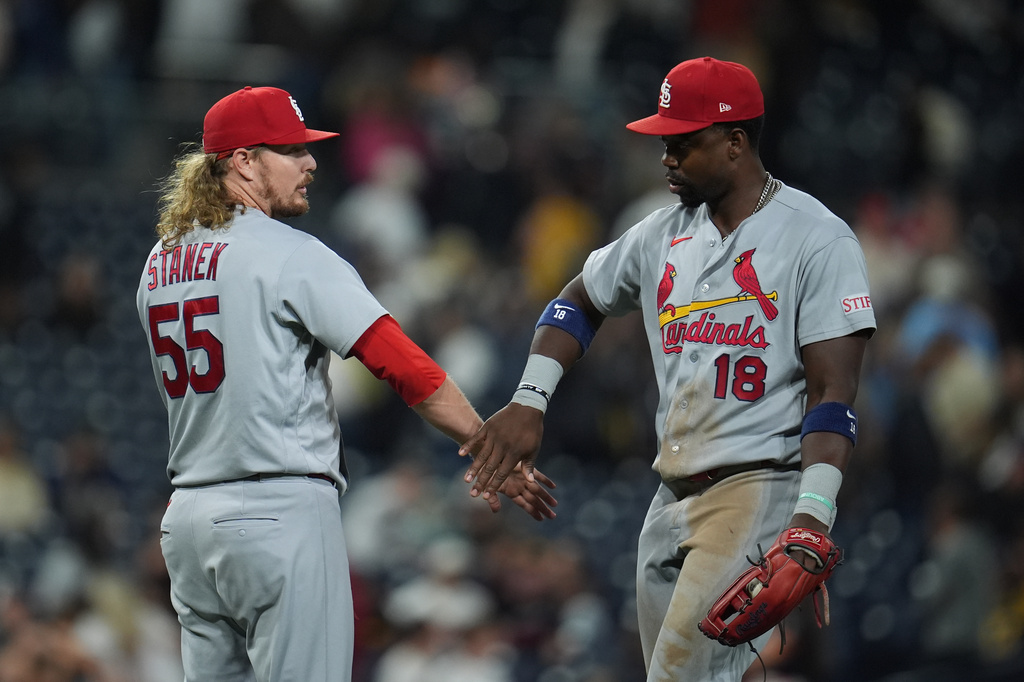 St. Louis Cardinals pitcher Ryne Stanek (55) celebrates with right fielder Jordan Walker after the Cardinals defeated the San Diego Padres 6-0 in a baseball game Friday, May 8, 2026, in San Diego. (AP Photo/Gregory Bull)