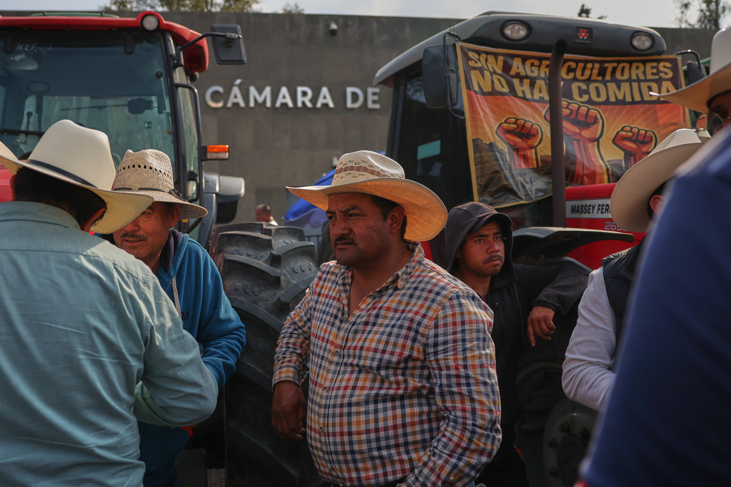 Farmers protest a proposed water law outside the Chamber of Deputies in Mexico City, Wednesday, Dec. 3, 2025. (AP Photo/Claudia Rosel)