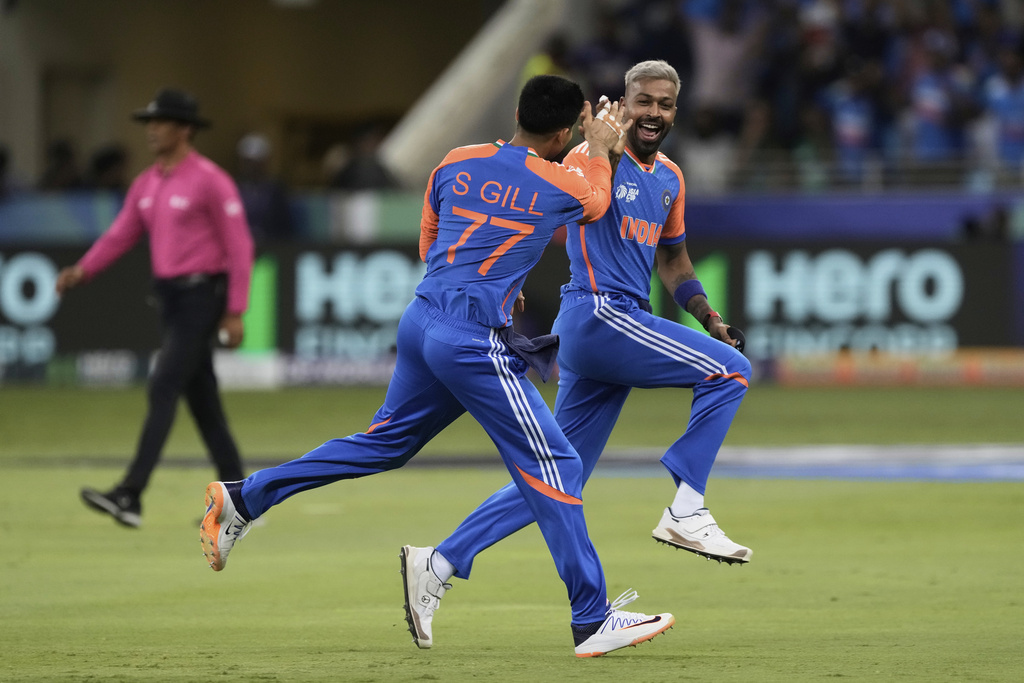 India's Hardik Pandya, right, celebrates with teammate Shubman Gill after the dismissal of Pakistan's Saim Ayub during the Asia Cup cricket match between India and Pakistan at Dubai International Cricket Stadium in Dubai, United Arab Emirates, Sunday, Sept. 14, 2025. (AP Photo/Fatima Shbair)
