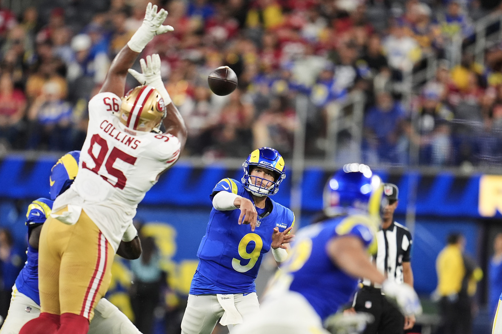 Los Angeles Rams quarterback Matthew Stafford (9) throws a pass past San Francisco 49ers defensive tackle Alfred Collins (95) during the second half of an NFL football game, Thursday, Oct. 2, 2025, in Inglewood, Calif. (AP Photo/Marcio Jose Sanchez)