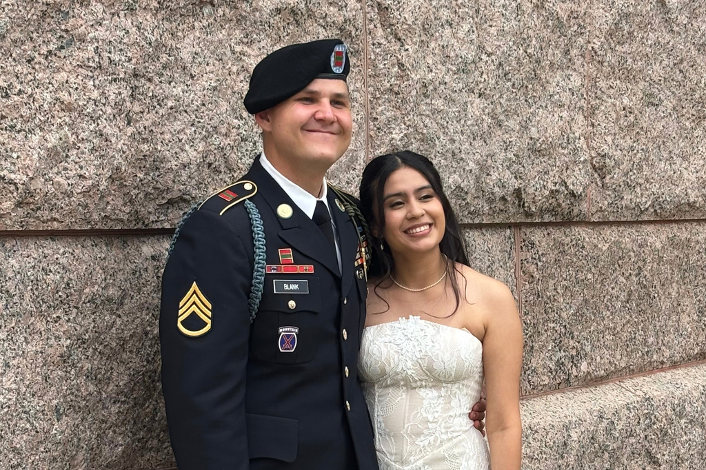 This photo provided by Jen Rickling shows U.S. Army staff sergeant, Matthew Blank, left, and his wife, Annie Ramos, posing for a photo while celebrating their wedding, in March, 2026, in Houston. (Jen Rickling via AP)