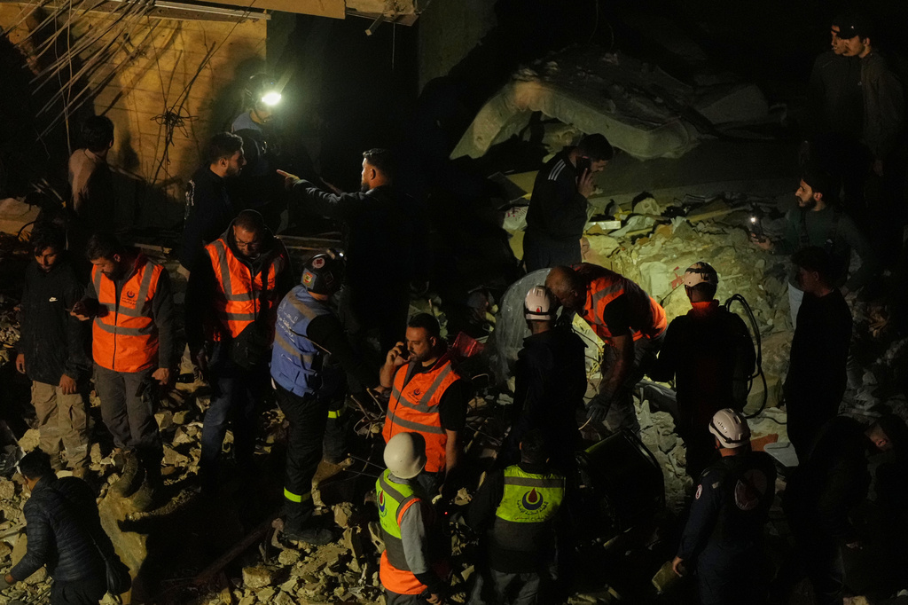 Rescue workers search through the rubble of a damaged building for survivors following an Israeli airstrike in Dahiyeh, Beirut's southern suburbs, Lebanon, Wednesday, May 6, 2026. (AP Photo/Hassan Ammar)