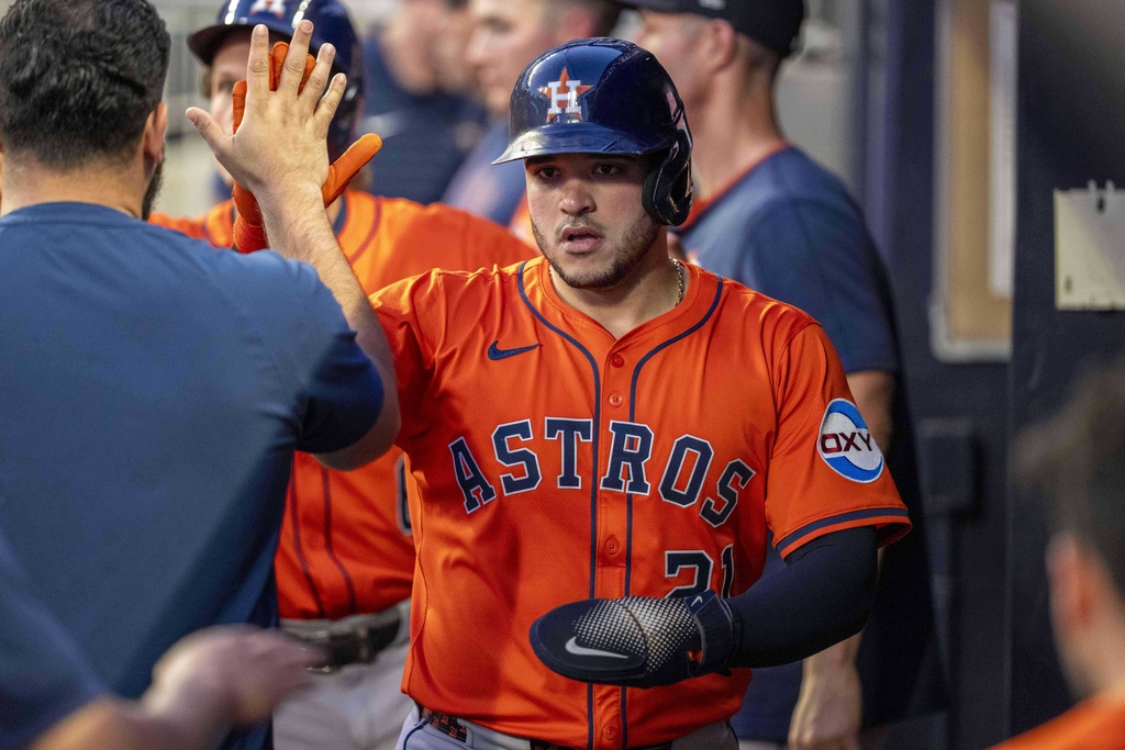 Houston Astros' Yainer Diaz (21) celebrates after scoring a run during the second inning of a baseball game against the Atlanta Braves, Saturday, Sept. 13, 2025, in Atlanta. (AP Photo/Erik Rank)