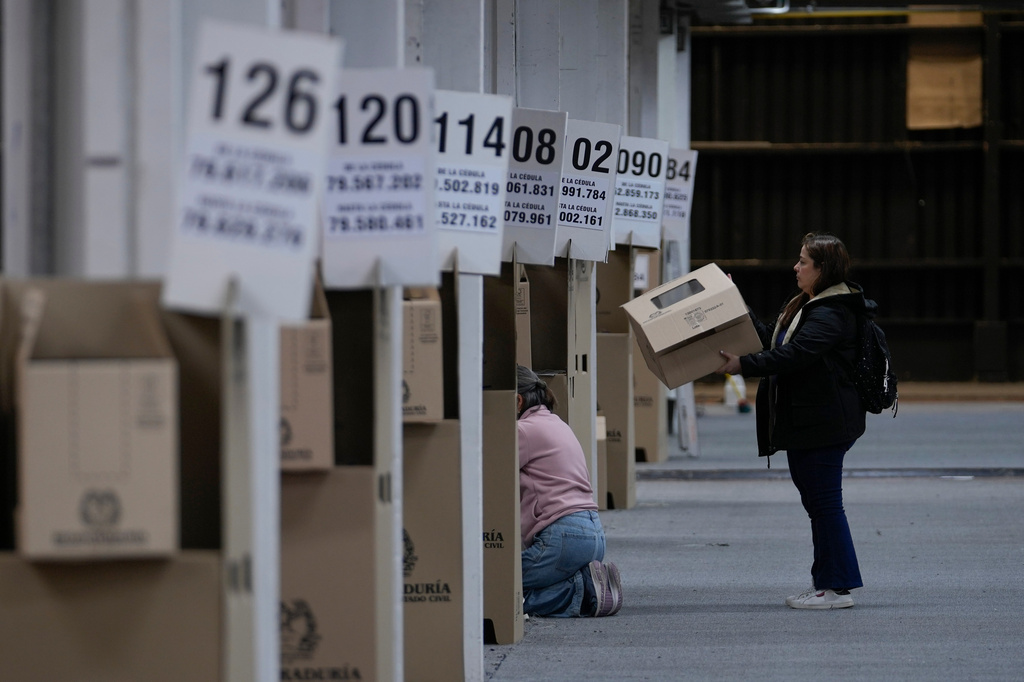 Electoral workers set up a voting center in preparation for Sunday's presidential election in Bogota, Colombia, Friday, May 29, 2026. (AP Photo/Matias Delacroix)