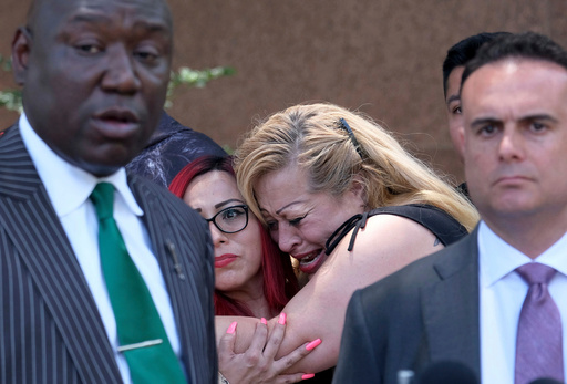 FILE - Nicole Castro cries as she hugs Janet Rameriz behind attorneys Ben Crump, left, and Adam Slater during a press conference with survivors of sexual abuse that occurred at MacLaren Hall, June 9, 2022 in Los Angeles. (Dean Musgrove/The Orange County Register via AP, File) FILE - Nicole Castro cries as she hugs Janet Rameriz behind attorneys Ben Crump, left, and Adam Slater during a press conference with survivors of sexual abuse that occurred at MacLaren Hall, June 9, 2022 in Los Angeles. (Dean Musgrove/The Orange County Register via AP, File)