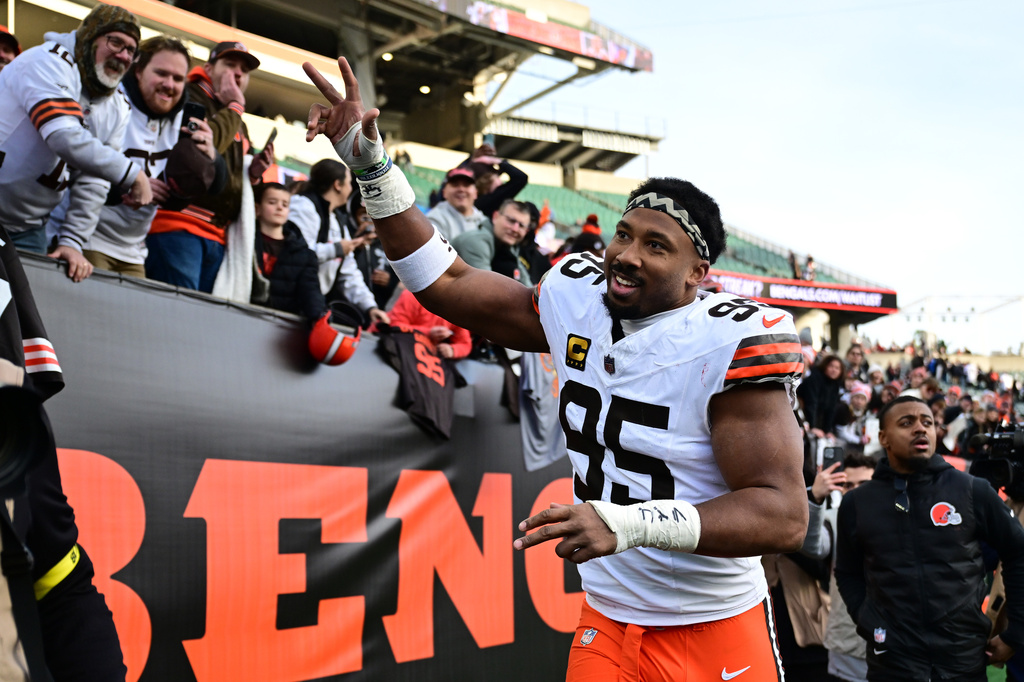 FILE - Cleveland Browns defensive end Myles Garrett celebrates with fans after an NFL football game against the Cincinnati Bengals in Cincinnati, Jan. 4, 2026. (AP Photo/David Dermer, File)