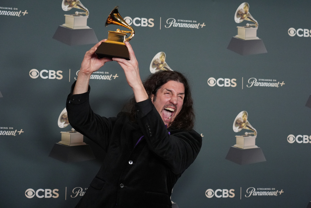 Frank Bello poses in the press room with the award for best rock performance for "Changes (Live From Villa Park) Back To The Beginning" during the 68th annual Grammy Awards on Sunday, Feb. 1, 2026, in Los Angeles. (Photo by Richard Shotwell/Invision/AP)