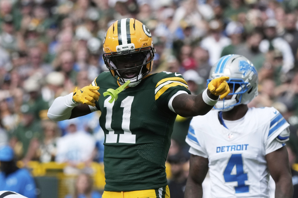 Green Bay Packers wide receiver Jayden Reed (11) reacts to a first down after a reception against the Detroit Lions during the first half of an NFL football game Sunday, Sept. 7, 2025, in Green Bay, Wis. (AP Photo/Morry Gash)