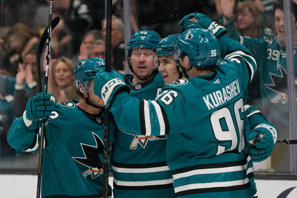 San Jose Sharks center Michael Misa, second from right, is congratulated by teammates after scoring against the Edmonton Oilers during the first period of an NHL hockey game in San Jose, Calif., Saturday, Feb. 28, 2026. (AP Photo/Jeff Chiu)