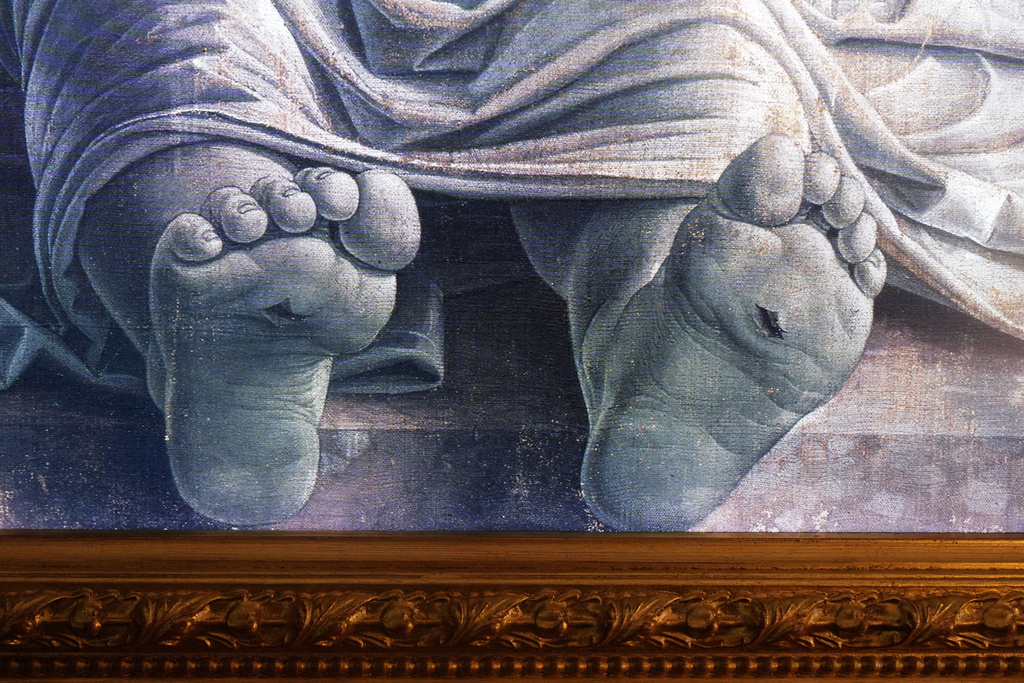 A detail of a high-definition, digital version of Andrea Mantegna's painting, "Cristo Morto nel Sepolcro e Tre Dolenti (The Lamentation Over the Dead Christ)," hangs at the Brera Art Gallery in Milan, Italy, Monday, Nov. 24, 2025. (Courtesy of Save the Artistic Heritage/Brera Art Gallery via AP)